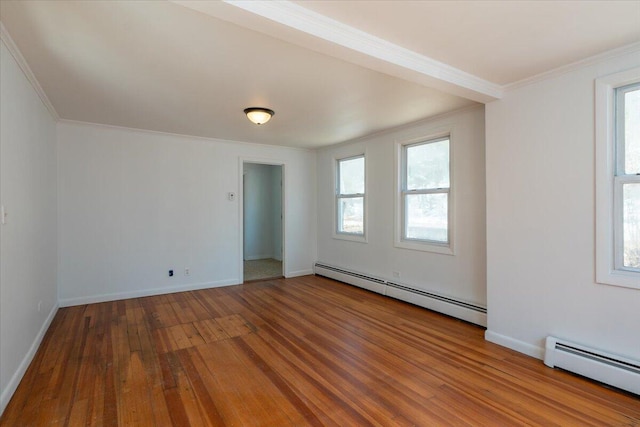 332 Back River Rd, Boothbay, ME 04537 - empty room featuring baseboard heating, hardwood / wood-style floors, ornamental molding, and baseboards