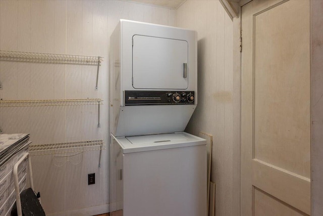 332 Back River Rd, Boothbay, ME 04537 - laundry area with stacked washer / drying machine and wood walls