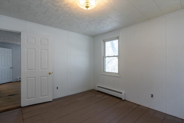 332 Back River Rd, Boothbay, ME 04537 - unfurnished room featuring baseboard heating and hardwood / wood-style flooring