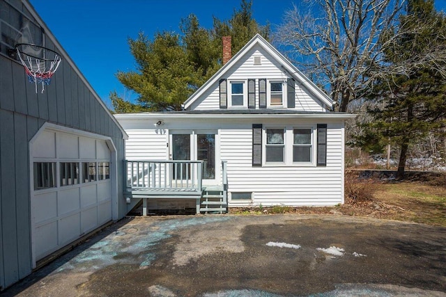 332 Back River Rd, Boothbay, ME 04537 - view of front facade with a chimney and a garage