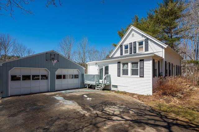 332 Back River Rd, Boothbay, ME 04537 - view of front facade featuring a garage and an outbuilding
