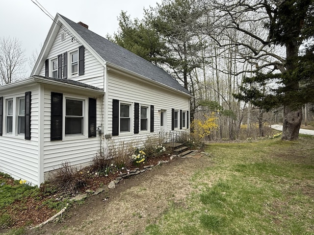 332 Back River Rd, Boothbay, ME 04537 - view of side of home featuring a yard, a chimney, and a shingled roof