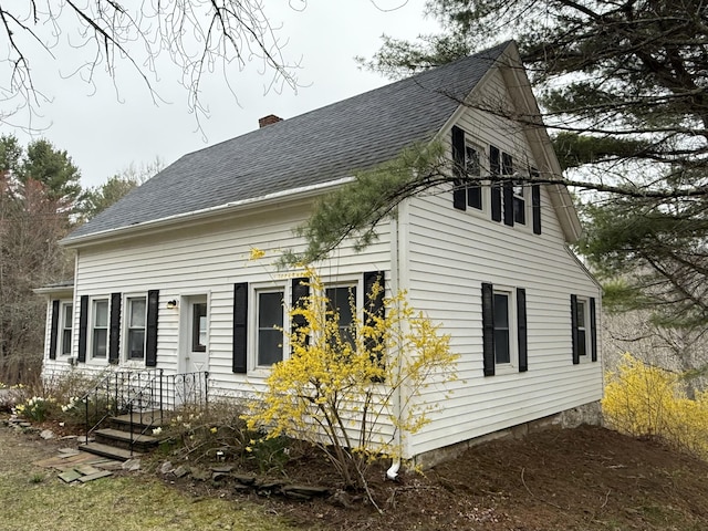 332 Back River Rd, Boothbay, ME 04537 - view of home's exterior featuring roof with shingles and a chimney