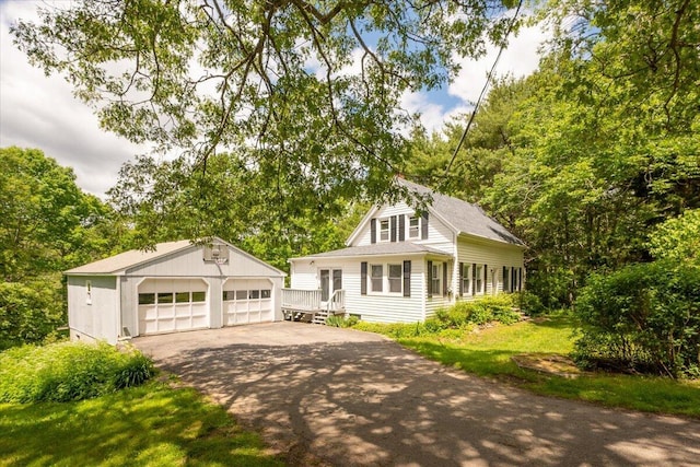 332 Back River Rd, Boothbay, ME 04537 - view of front of property with an outbuilding, a detached garage, and a shingled roof