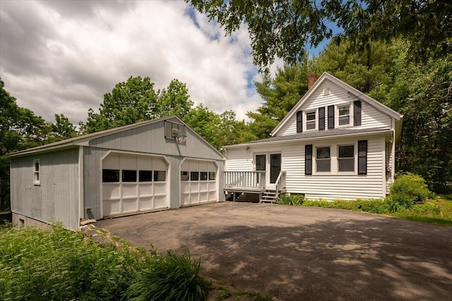 332 Back River Rd, Boothbay, ME 04537 - view of front of property with a garage, an outdoor structure, and a chimney