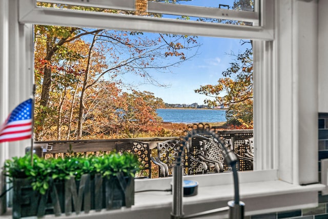 balcony featuring a water view