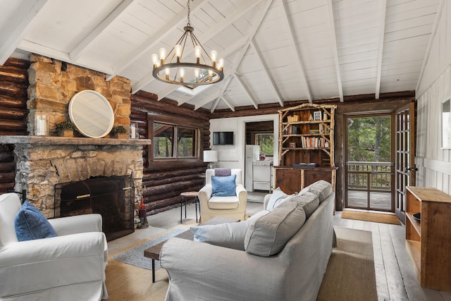 14 Crooked Pine Rd, Boothbay Harbor, ME 04538 - living area featuring a chandelier, rustic walls, a stone fireplace, wood-type flooring, and wooden ceiling