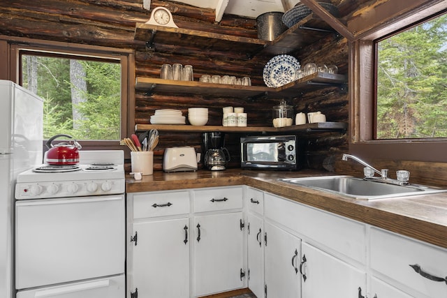 14 Crooked Pine Rd, Boothbay Harbor, ME 04538 - kitchen with open shelves, white electric range oven, a sink, and healthy amount of natural light