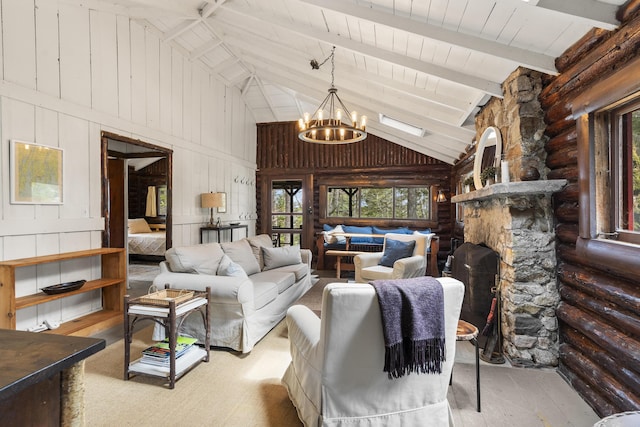 14 Crooked Pine Rd, Boothbay Harbor, ME 04538 - living room featuring a chandelier, high vaulted ceiling, a fireplace, rustic walls, and wood finished floors