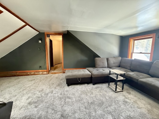 living room featuring lofted ceiling and carpet floors