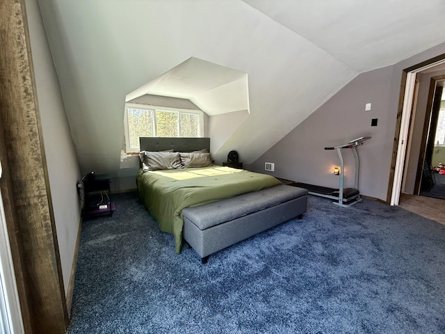 bedroom featuring vaulted ceiling, carpet flooring, and baseboards