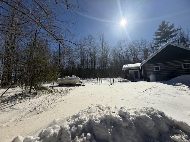 view of yard layered in snow