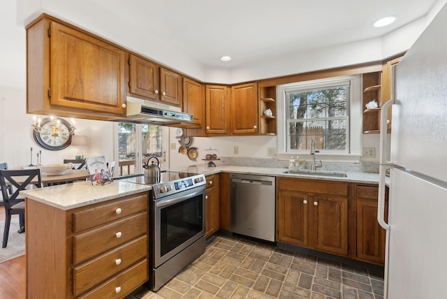 kitchen featuring a sink, under cabinet range hood, recessed lighting, stainless steel appliances, and open shelves