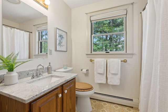 bathroom with a baseboard heating unit, toilet, vanity, and a shower with curtain