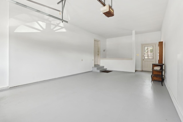 garage featuring baseboards and a garage door opener