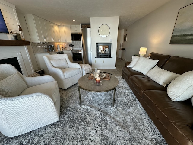 carpeted living area with a fireplace