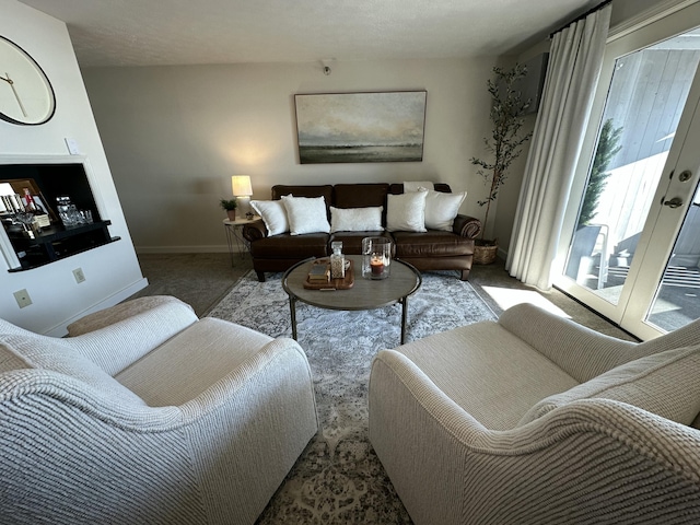 living room with carpet and baseboards