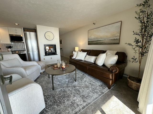 living room featuring a textured ceiling and baseboards