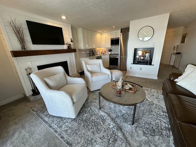 carpeted living area featuring a fireplace, baseboards, a textured ceiling, and recessed lighting