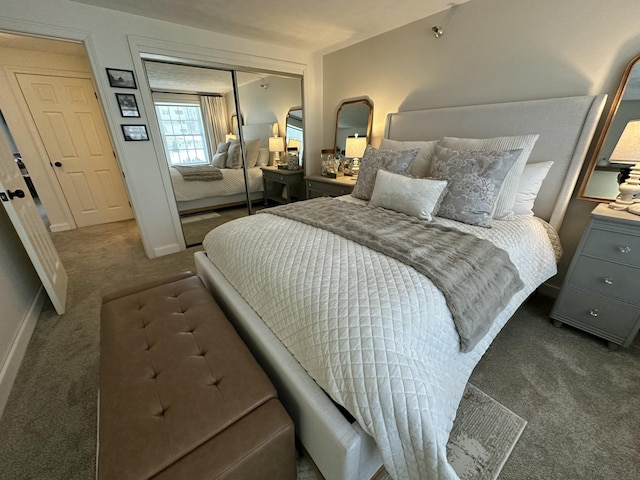 bedroom featuring a closet, carpet, and baseboards