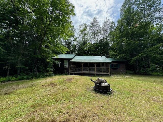 view of yard with a fire pit