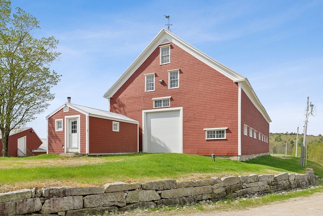 49 Megquier Rd, Gray, ME 04039 - rear view of house featuring a lawn and an outbuilding