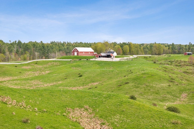49 Megquier Rd, Gray, ME 04039 - view of yard featuring a pole building, an outbuilding, a wooded view, and a view of rural / pastoral area