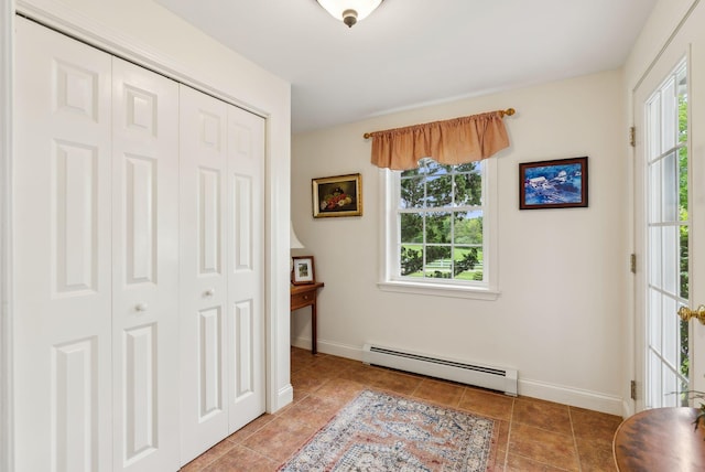 49 Megquier Rd, Gray, ME 04039 - bedroom with a baseboard heating unit, tile patterned flooring, and baseboards