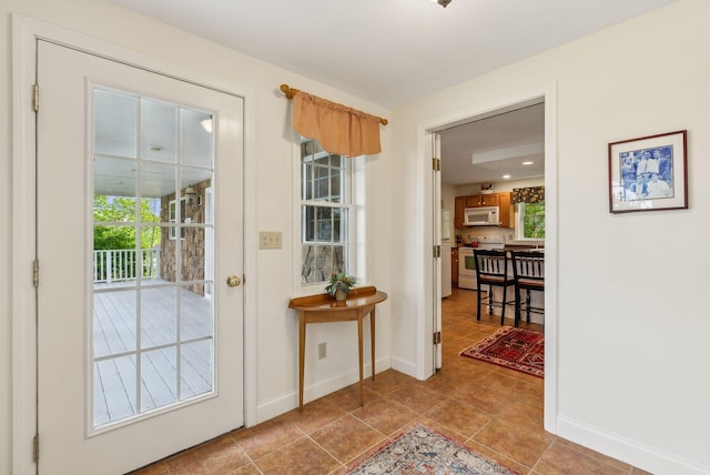 49 Megquier Rd, Gray, ME 04039 - doorway with baseboards and tile patterned floors