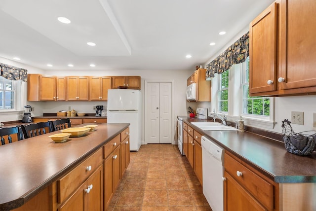 49 Megquier Rd, Gray, ME 04039 - kitchen featuring white appliances, dark countertops, recessed lighting, and brown cabinets