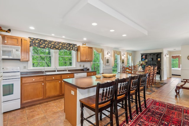 49 Megquier Rd, Gray, ME 04039 - kitchen featuring white appliances, a sink, dark countertops, a kitchen breakfast bar, and recessed lighting