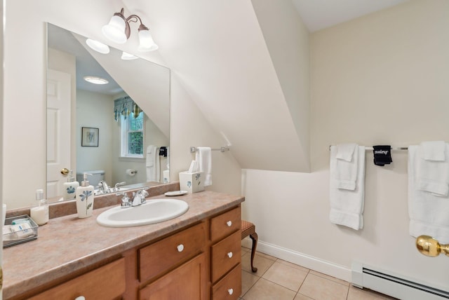 49 Megquier Rd, Gray, ME 04039 - bathroom featuring a baseboard heating unit, toilet, vanity, and tile patterned floors