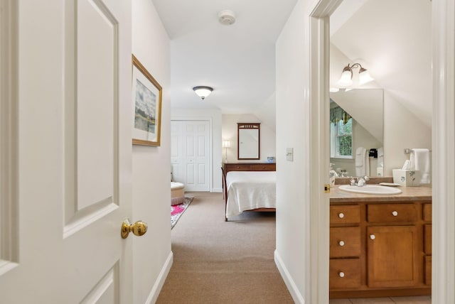 49 Megquier Rd, Gray, ME 04039 - ensuite bathroom featuring vanity, vaulted ceiling, and baseboards