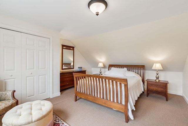 49 Megquier Rd, Gray, ME 04039 - carpeted bedroom with vaulted ceiling, baseboards, and a closet