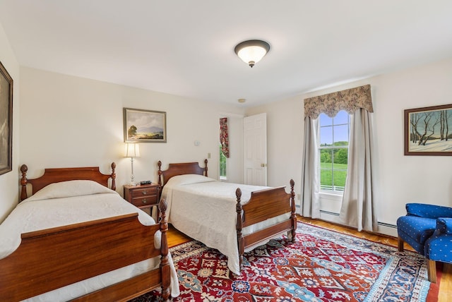 49 Megquier Rd, Gray, ME 04039 - bedroom featuring wood finished floors and a baseboard radiator