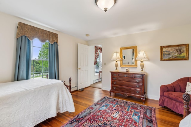 49 Megquier Rd, Gray, ME 04039 - bedroom with a baseboard radiator, wood finished floors, and baseboards