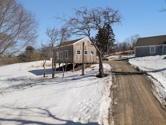 exterior space featuring an outbuilding and driveway