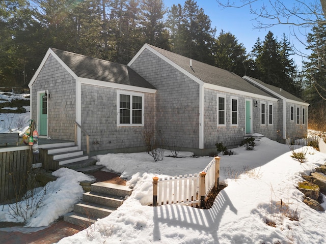 view of front of home featuring a shingled roof