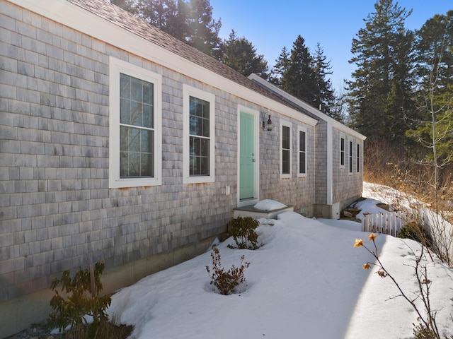 view of front of home featuring roof with shingles