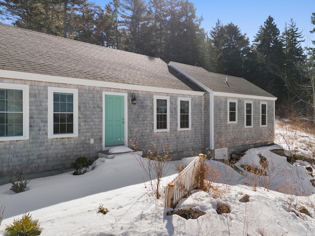 view of front of property featuring roof with shingles