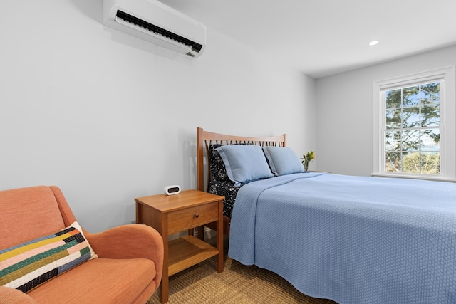 bedroom with light carpet, an AC wall unit, and recessed lighting