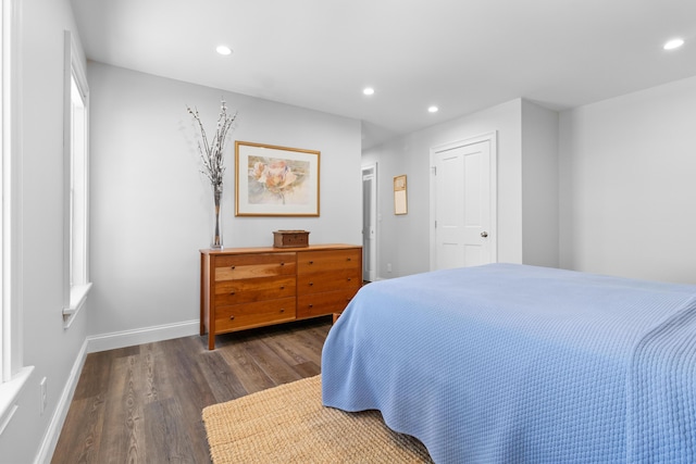 bedroom with baseboards, dark wood finished floors, and recessed lighting