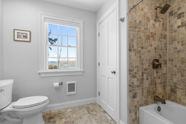 full bathroom featuring bathtub / shower combination, baseboards, and toilet