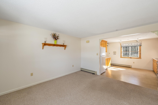 unfurnished room with baseboards, light colored carpet, a textured ceiling, and baseboard heating