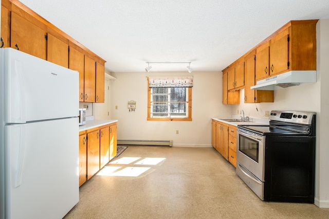 kitchen with a baseboard radiator, under cabinet range hood, electric range, a sink, and freestanding refrigerator