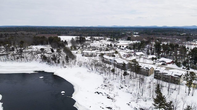 snowy aerial view with a mountain view