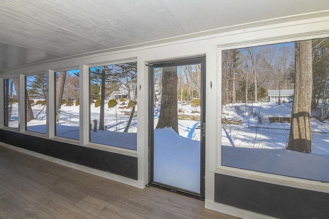 doorway to outside with wood finished floors