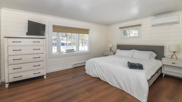 bedroom featuring ornamental molding, a baseboard radiator, dark wood-style flooring, and a wall mounted AC