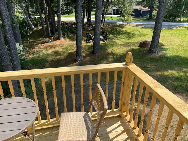 wooden terrace with a yard