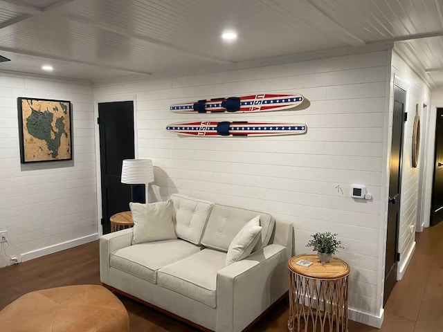 living area featuring baseboards, wood finished floors, and recessed lighting